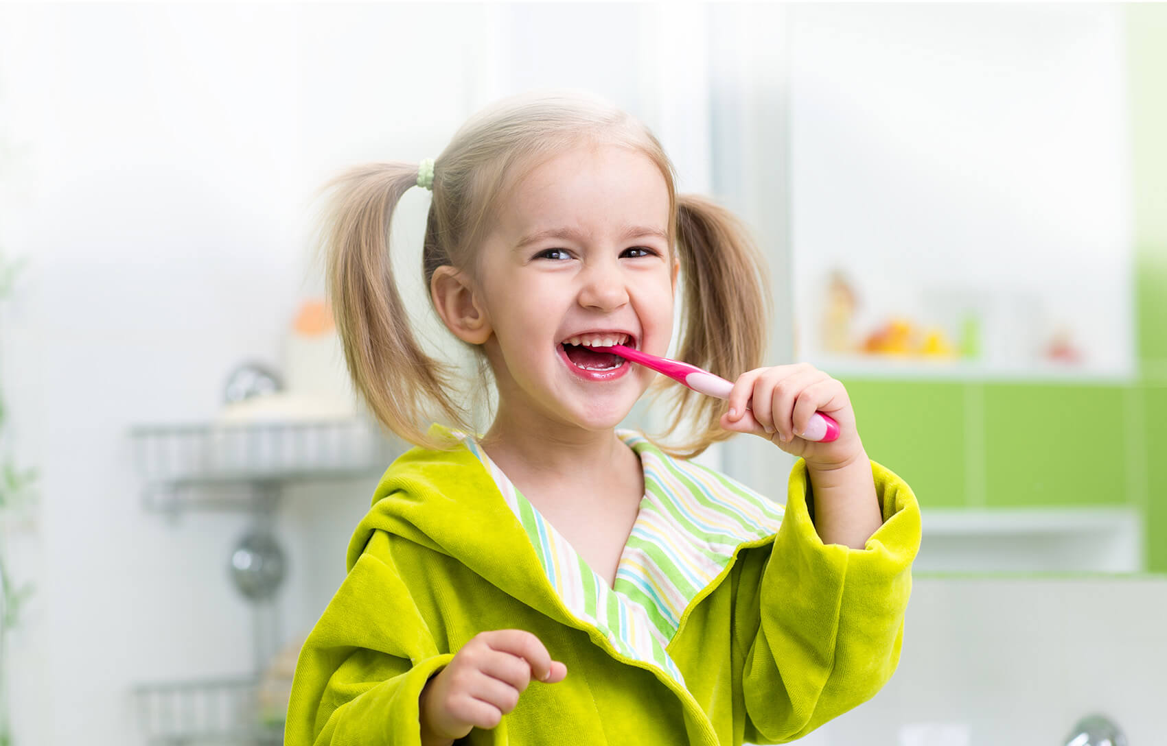 young girl brushing her teeth